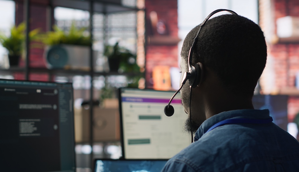 Customer center expert uses AI assistant to generate technical solutions Customer center expert uses AI assistant to generate technical solutions for clients. Call center agent uses artificial intelligence LLM chatbot to provide step by step guidance to customers, camera A